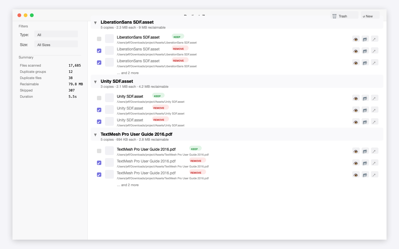 Scan results showing duplicate groups with KEEP and REMOVE badges, file preview buttons, and scan summary
